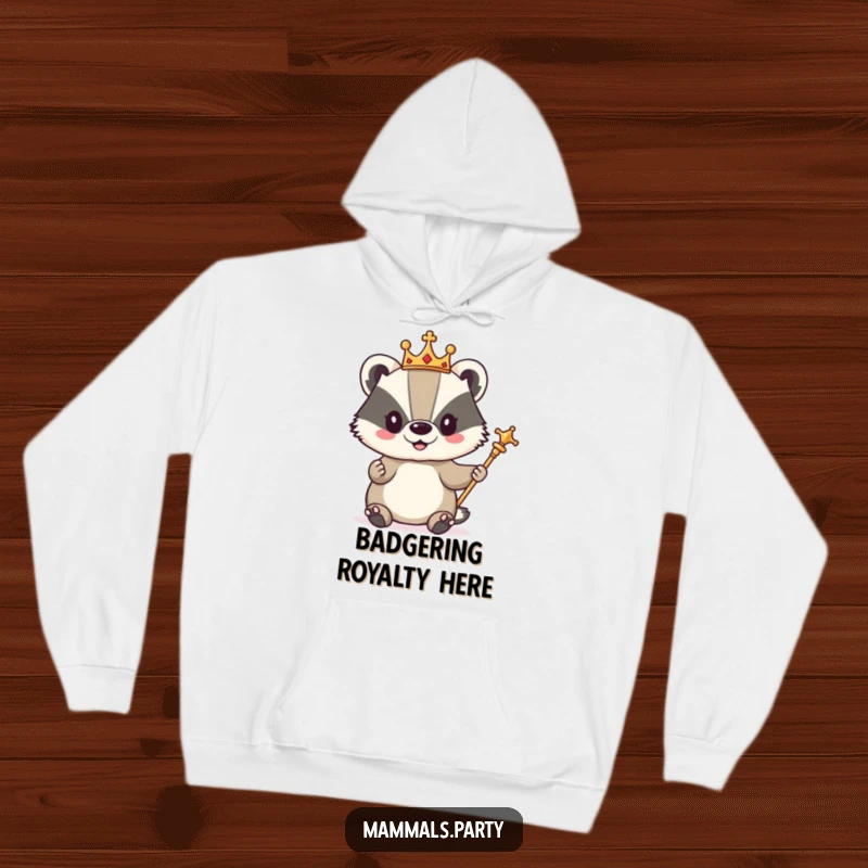 Funny hoodie showcasing a cute badger character regal in a small crown and scepter, looking comfortably in charge.