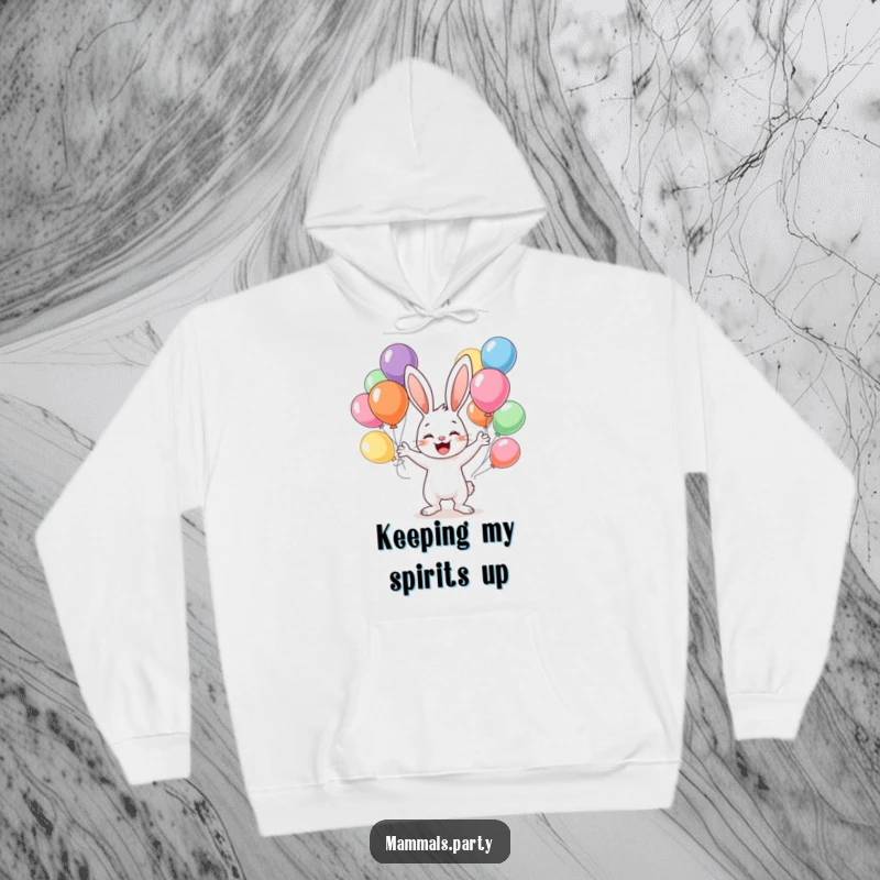 Funny hoodie depicting a happy bunny character juggling multiple colorful balloons, perfect for staying warm and cheerful.