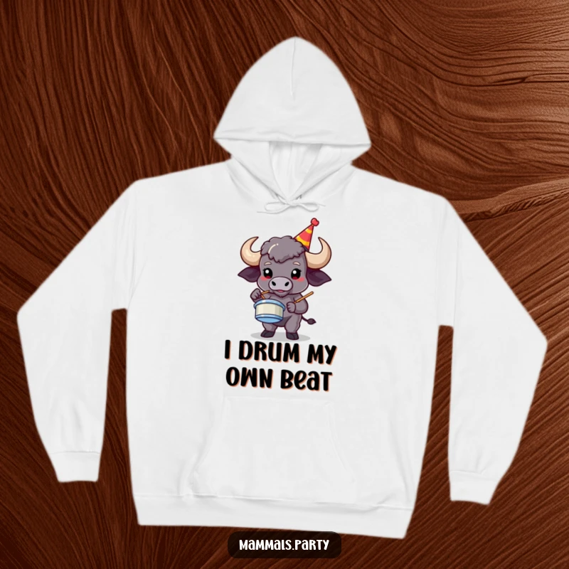 Funny buffalo character in a party hat, rocking out on air drums, featured on a warm, humorous hoodie.