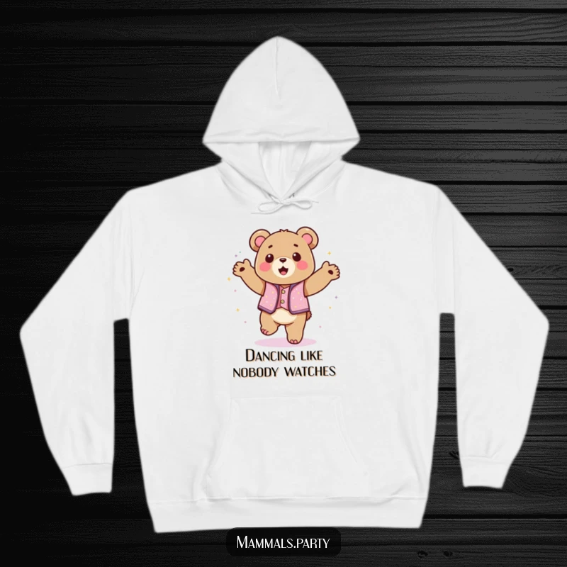 Funny kawaii bear in a sparkly vest dancing with abandon on a cozy hoodie, offering warm and humorous vibes.