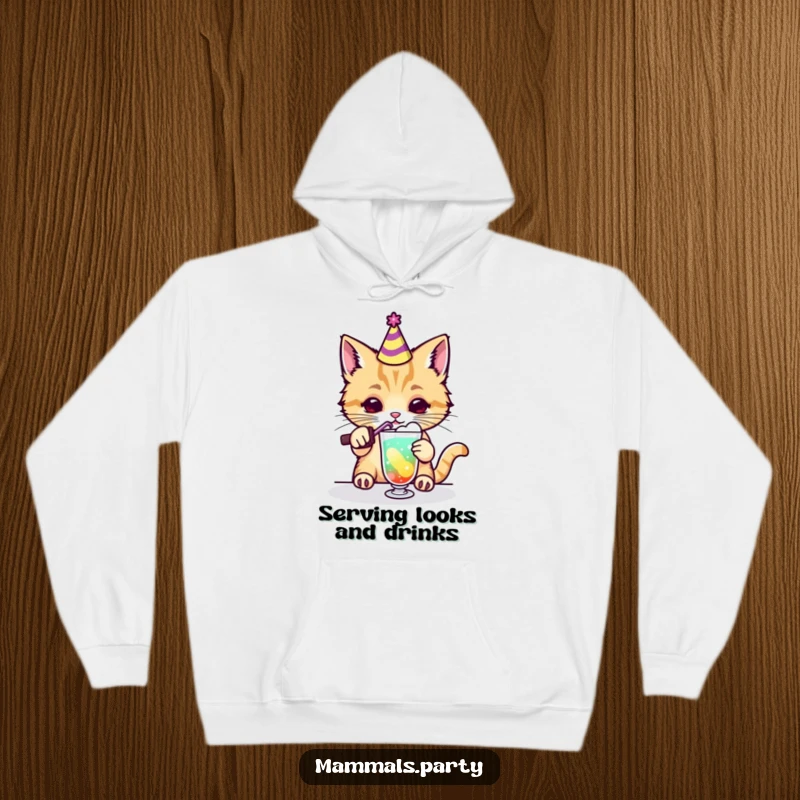Funny kawaii cat in a party hat mixing a vibrant drink, featured on a cozy hoodie, ideal for humorous and warm apparel.