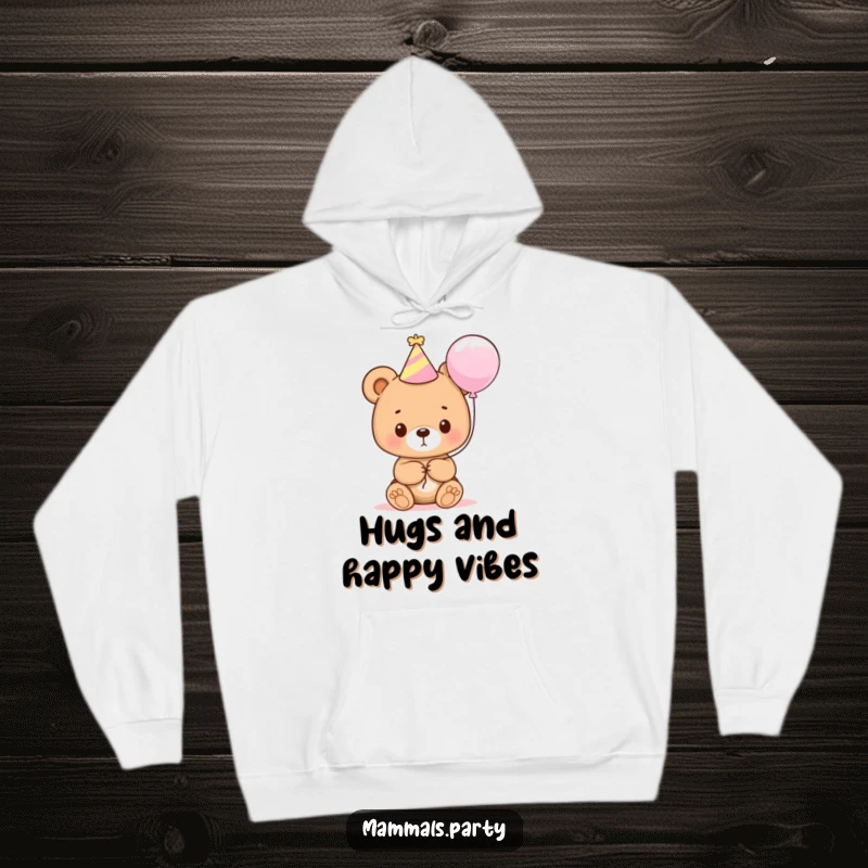 Funny and cute bear cub in a party hat holding a balloon, radiating joy and comfort in a cozy hoodie.