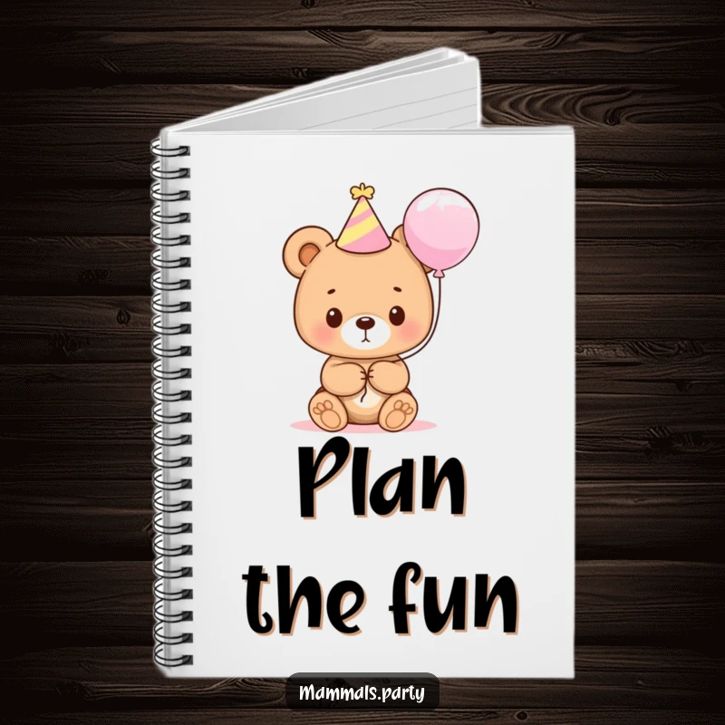 Funny bear cub wearing a party hat and holding a balloon, featured on the cover of a notebook for jotting ideas.