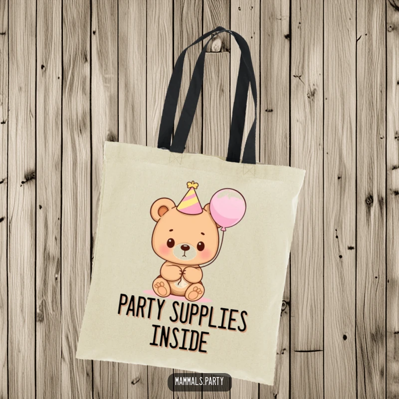 Funny bear cub wearing a party hat, holding a balloon, printed on a sturdy tote bag for cheerful carrying.